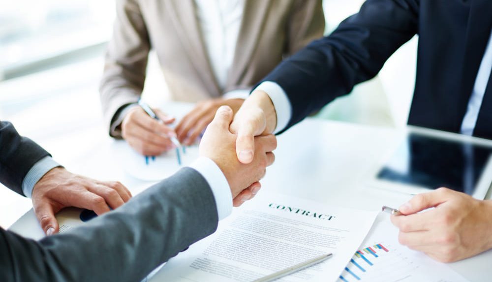 handshake-close-up-executives (1) handshake-close-up-executives (1)
